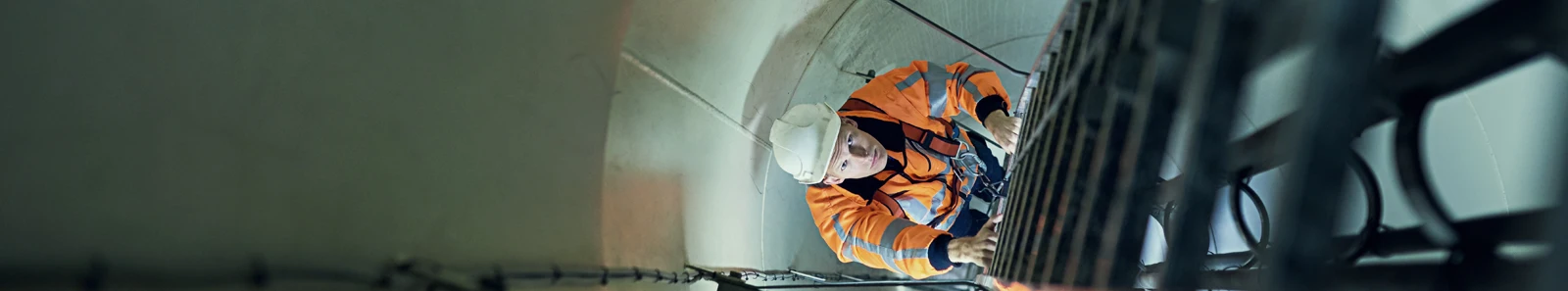 Picture of engineer climbing ladder in tunnel