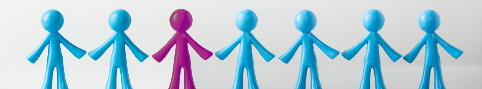 Picture of figures holding hands, one figure is a different colour