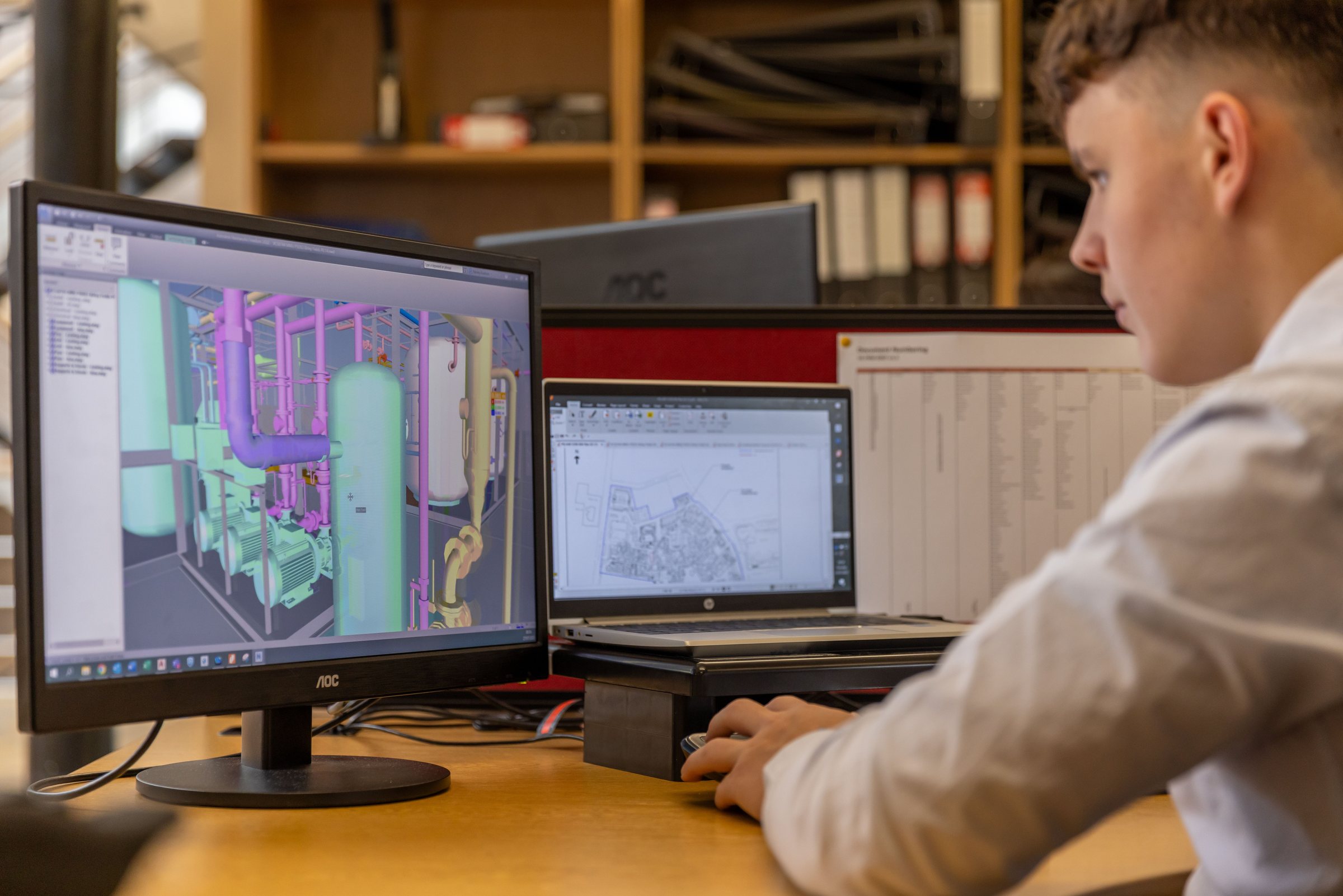Engineer working on a mechanical design at a workstation